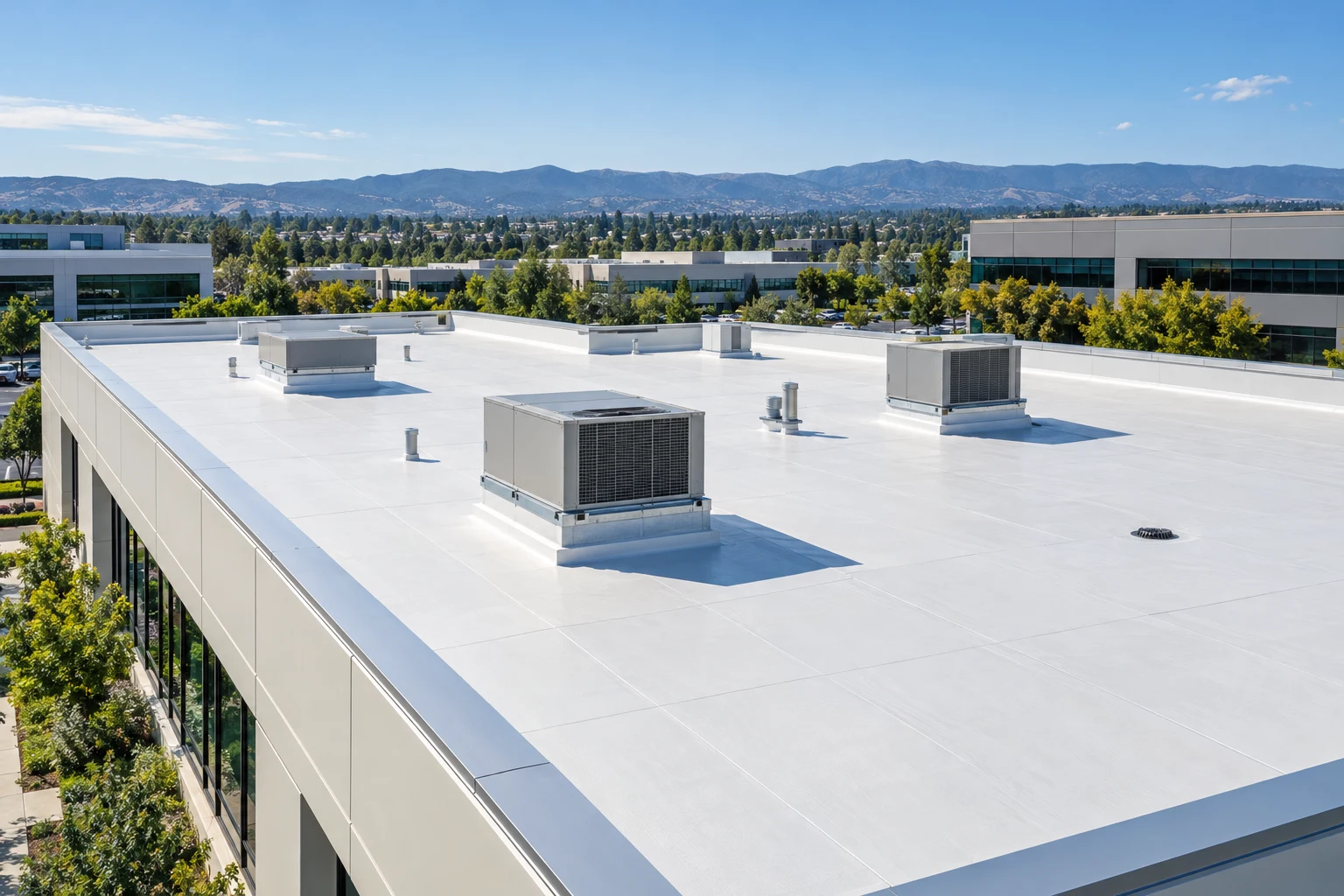 Low-slope white roofs on a commercial campus